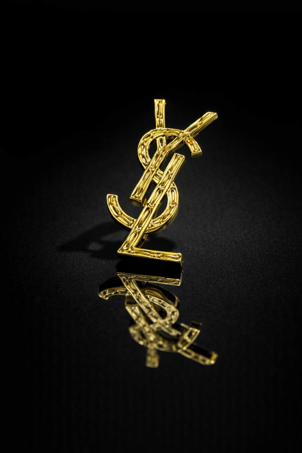 Broche YSL doré